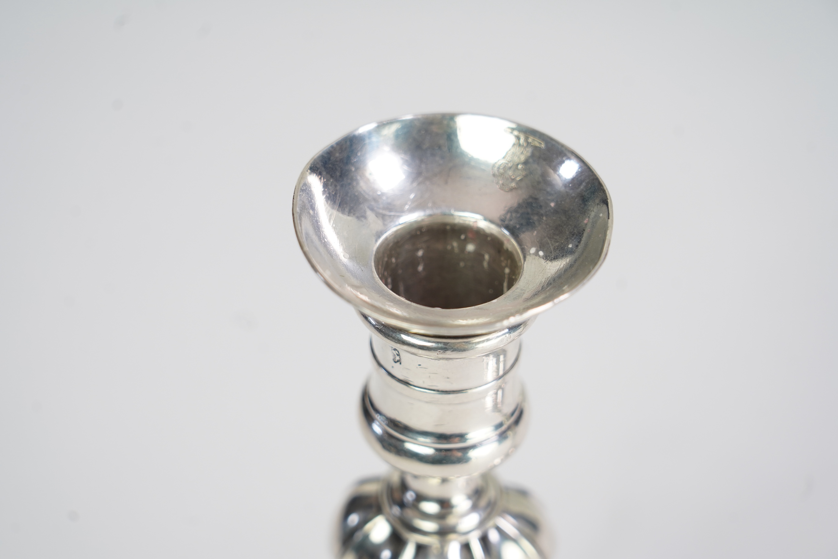 A pair of George II cast silver candlesticks, by Susannah Hatfield